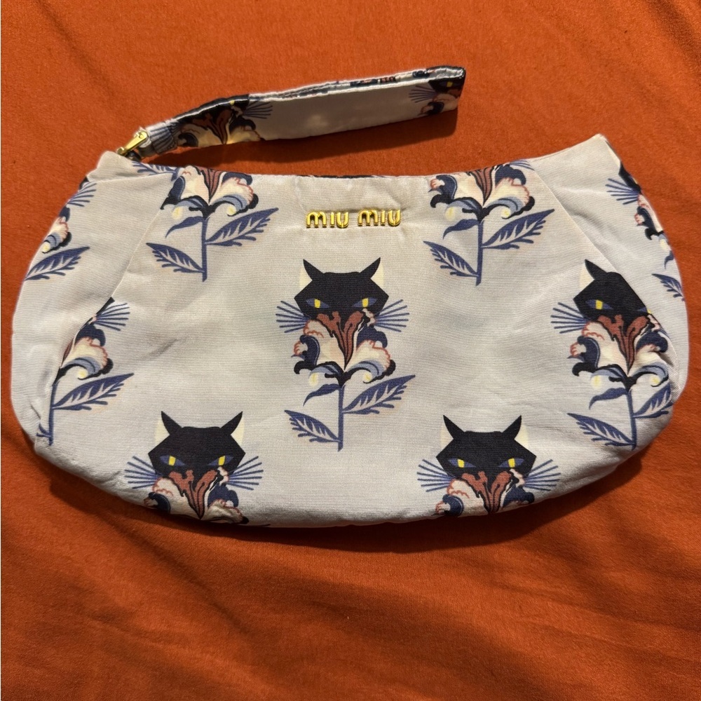 Miumiu wristlet in fabric. Limited edition
